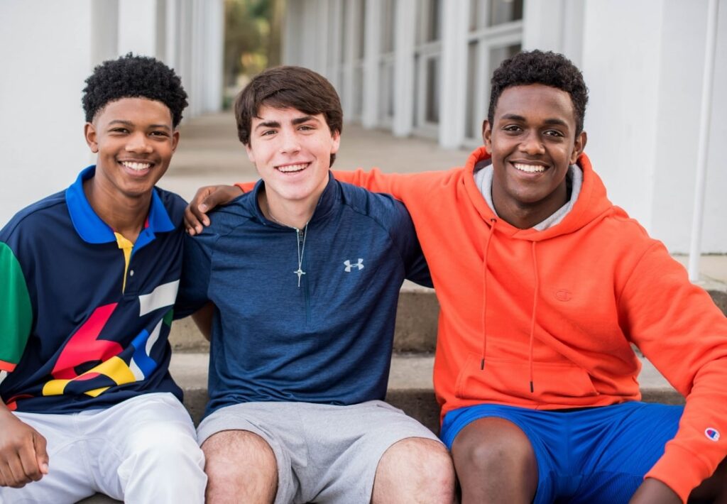 teens pose for a picture after discussing invisalign faqs
