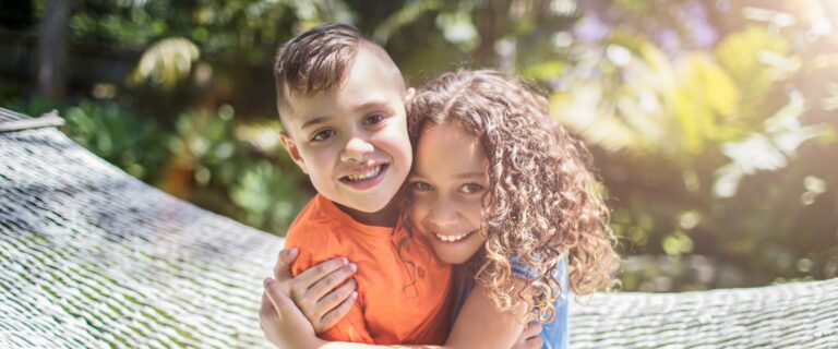 kids hug in hammock swing and ask mom How long does a palatal expander stay in