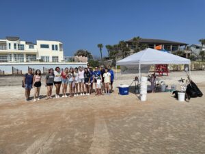 morejon and andrews orthodontics team at beach cleanup